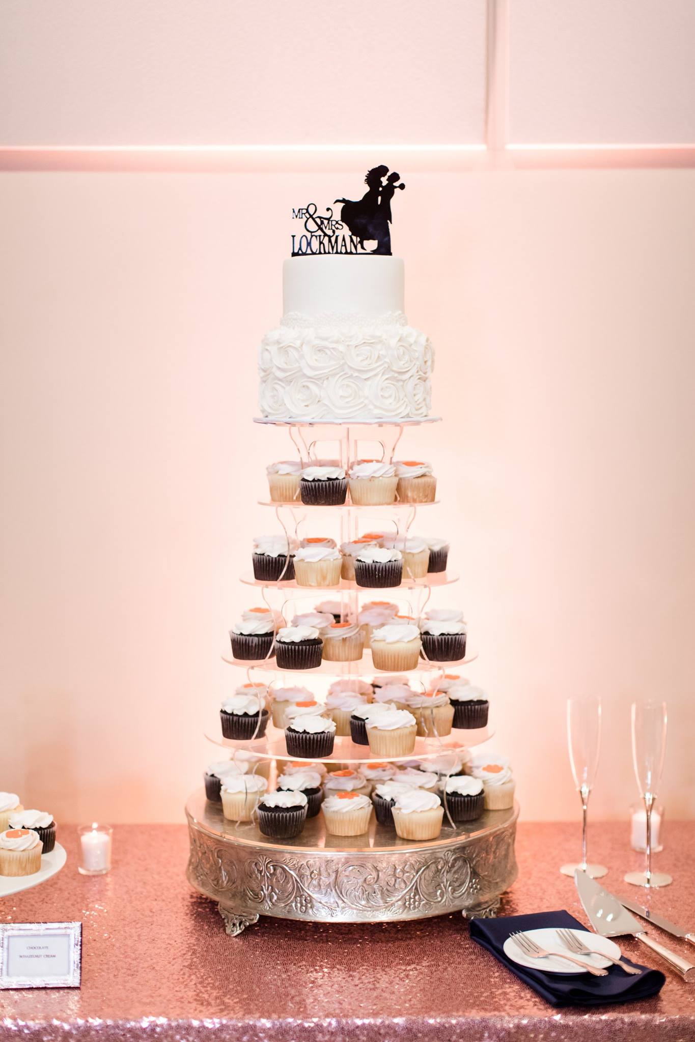 wedding cake with cupcakes on tiered cake stand