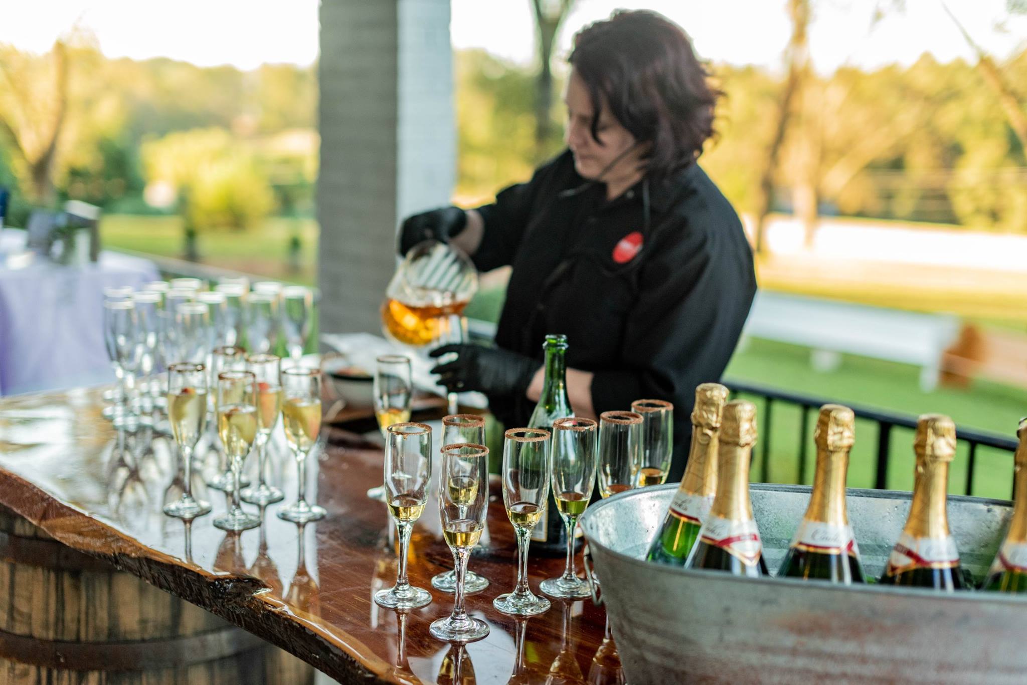 bartender pouring champagne