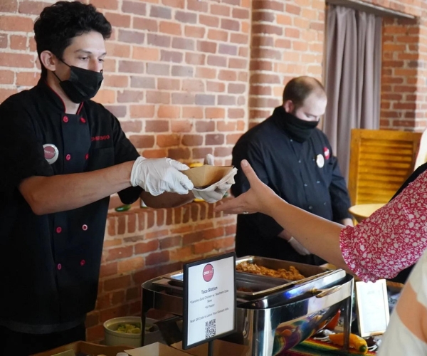 CHEF360 Catering 1 catering staff serving meal